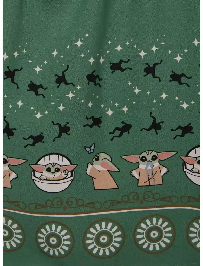 Star Wars Baby Yoda and flying figures on green fabric.