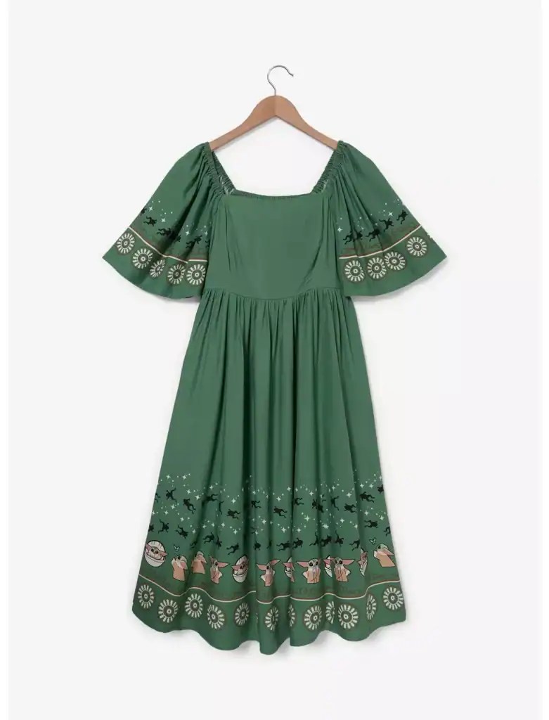 Inspired green dress with festive patterns and puff sleeves.