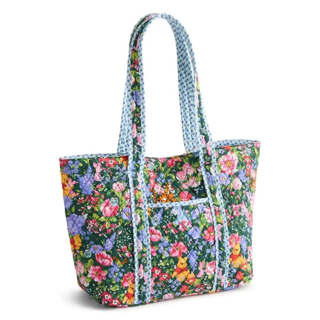 Colorful Disney floral tote bag with vibrant flower patterns and character accents.