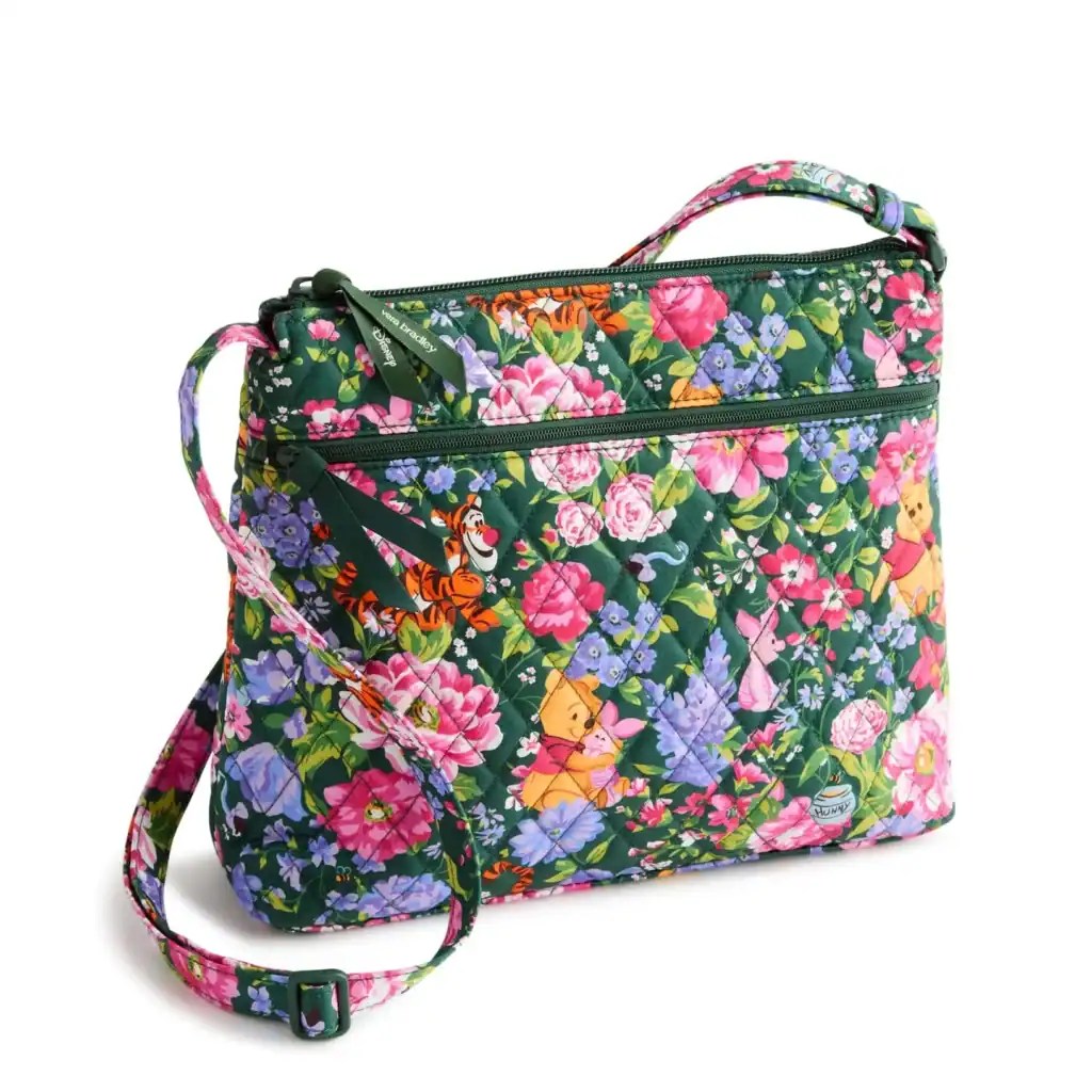 Colorful floral crossbody bag featuring Tigger and Pooh characters from Disney.