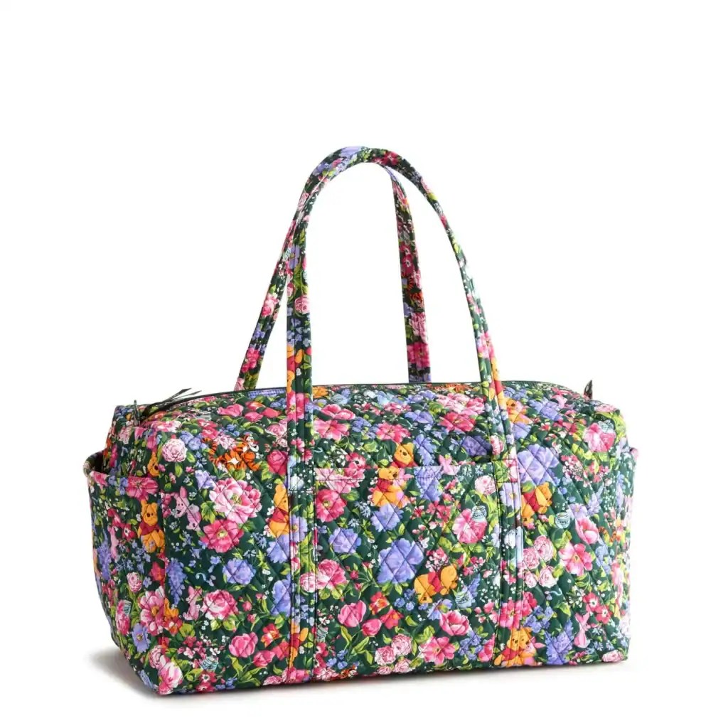 Colorful floral quilt tote bag with handles, perfect for casual outings.