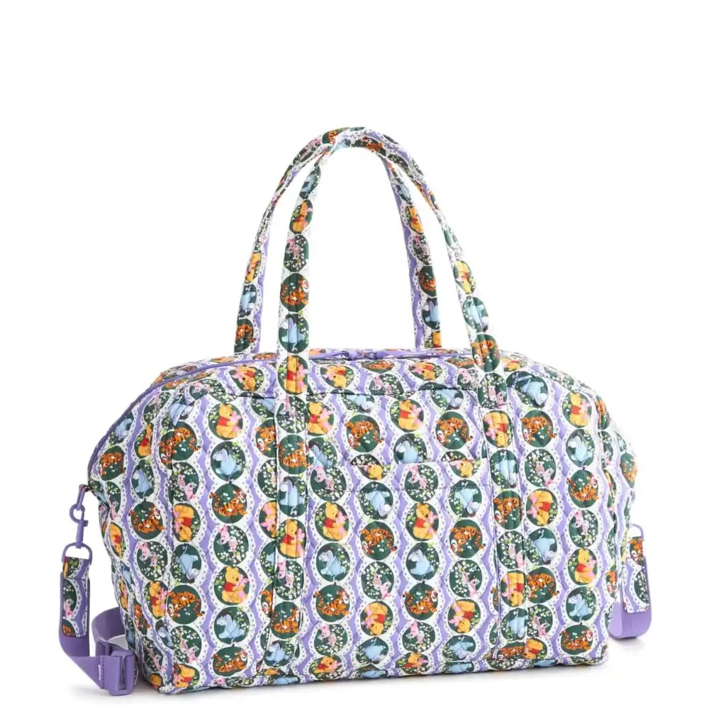 Colorful patterned tote bag with Disney-inspired design and purple accents.