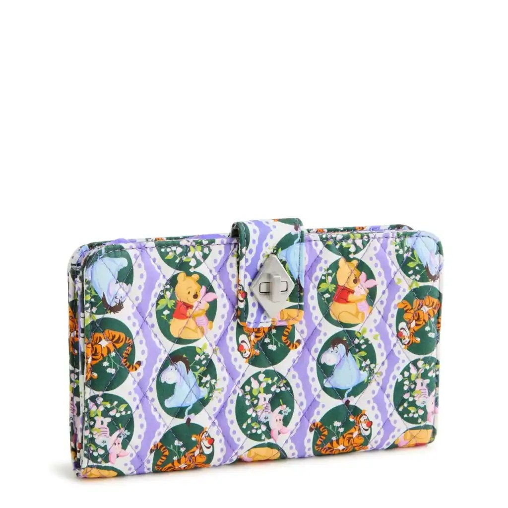 Colorful Winnie the Pooh themed wallet with floral and tiger patterns.