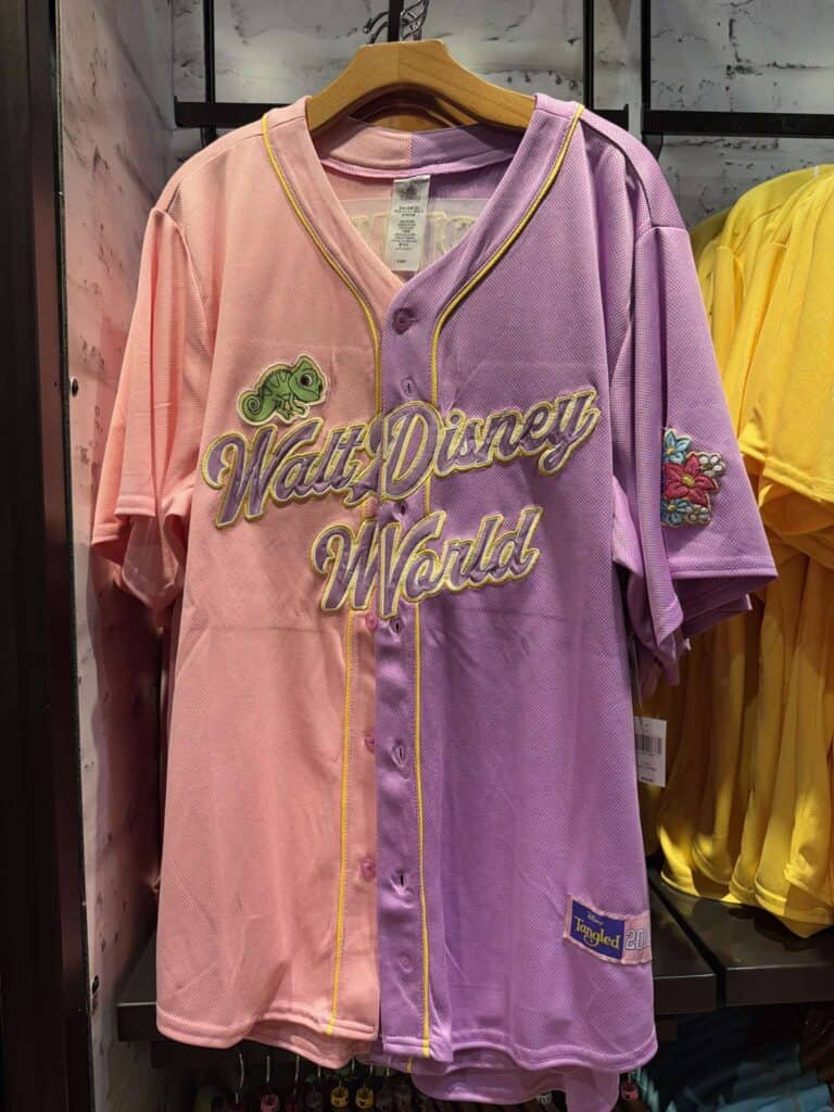 Pink and purple Walt Disney World baseball jersey with embroidered patches.