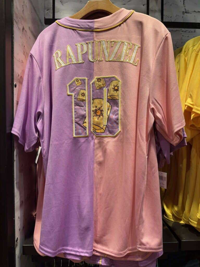 Disney Rapunzel themed pink and purple jersey with floral design.
