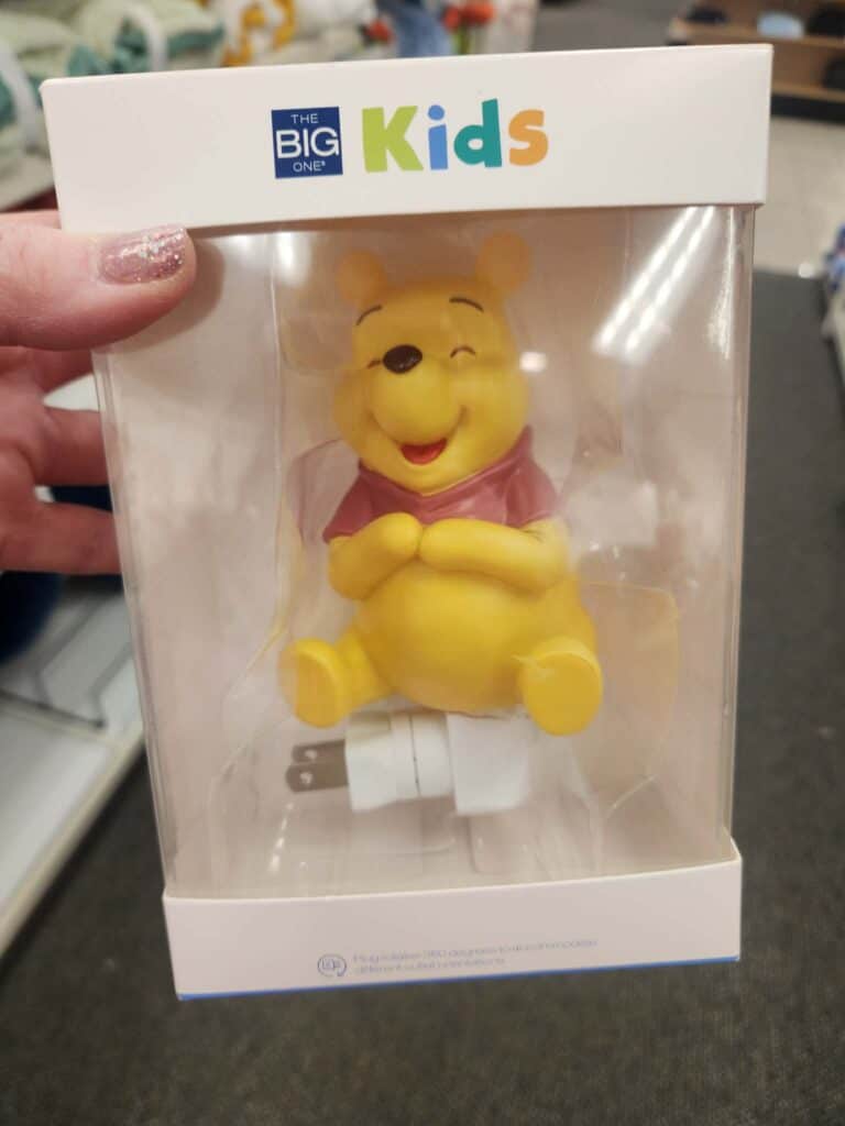 Winnie the Pooh plush toy in packaging, perfect for children.