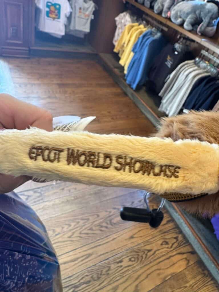 Disney World Showcase plush headband with embroidered logo.