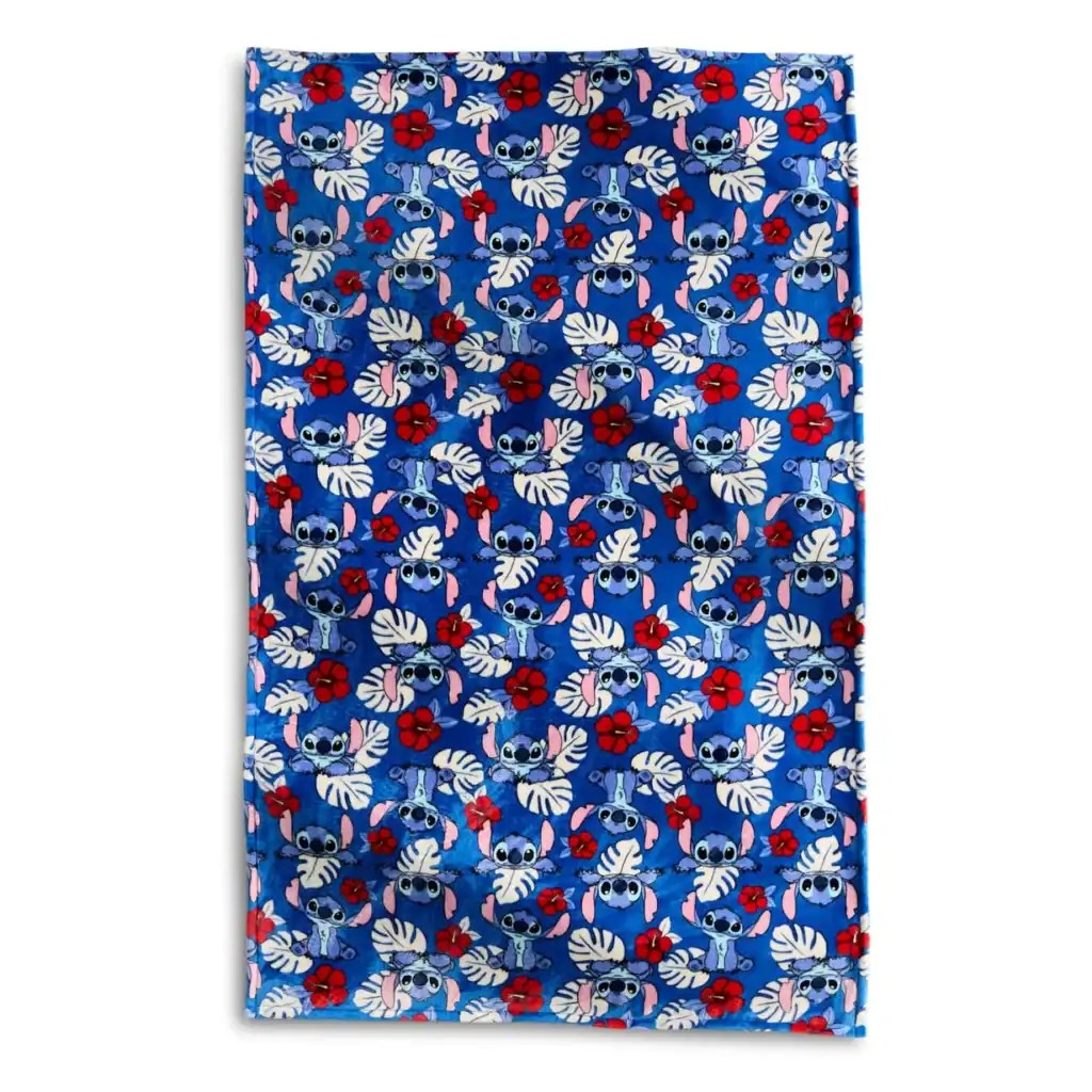 Colorful Disney Stitch beach towel with red hibiscus flowers, perfect for summer fun.