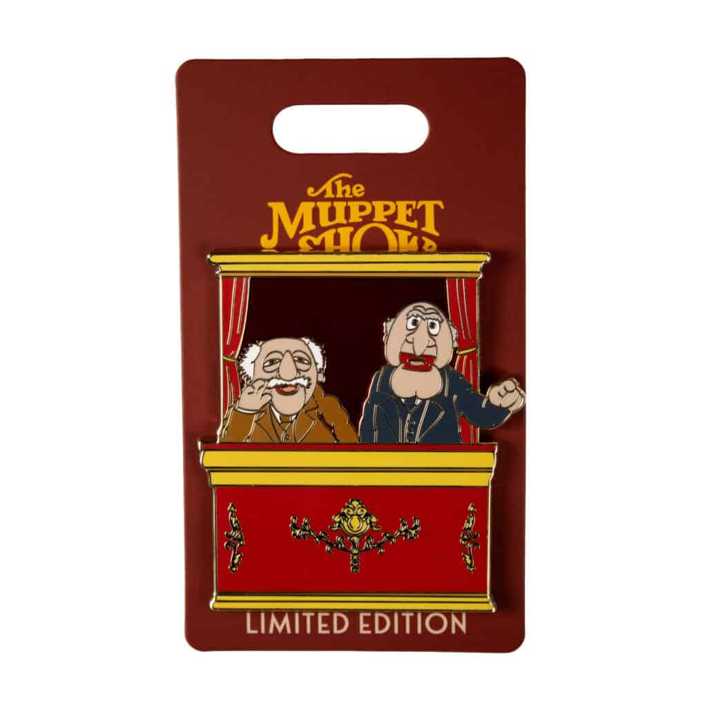 Muppet Show enamel pin featuring Statler and Waldorf puppets on a red background.