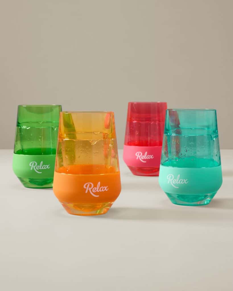 Bright, multicolored plastic cups with "Relax" printed on each, ideal for Disney fans.