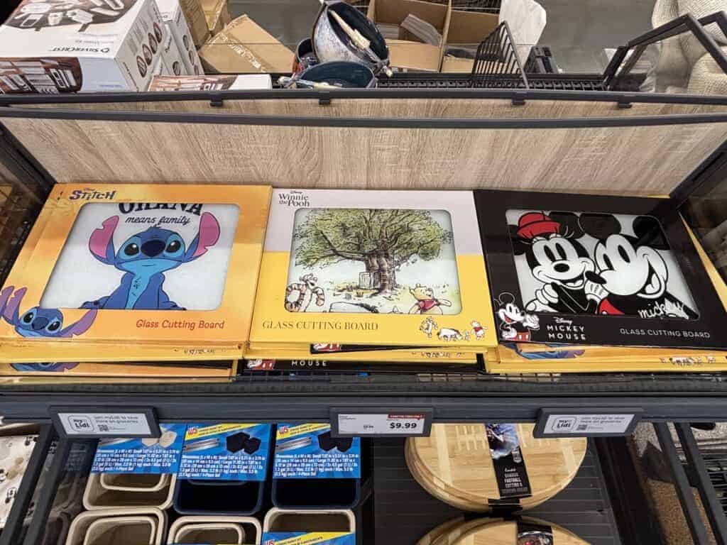 Disney Stitch glass cutting board with colorful design and playful character image.