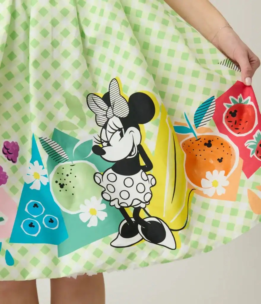 Minnie Mouse dress featuring colorful fruit and floral patterns, perfect for Disney fans and summer.