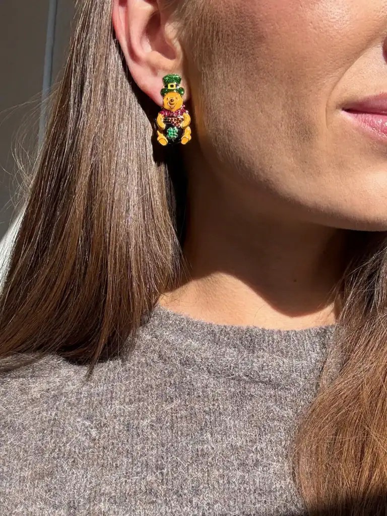 Tigger-themed St. Patrick's Day earring with shamrock and rainbow details.