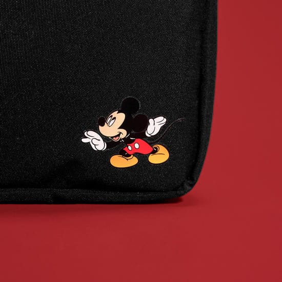 Mickey Mouse cartoon backpack on red background.