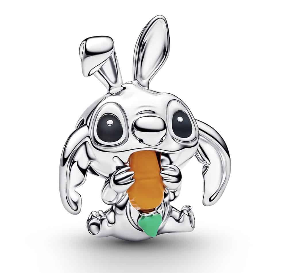Shiny silver bunny figurine holding an orange carrot with green leaves, featuring large expressive e.