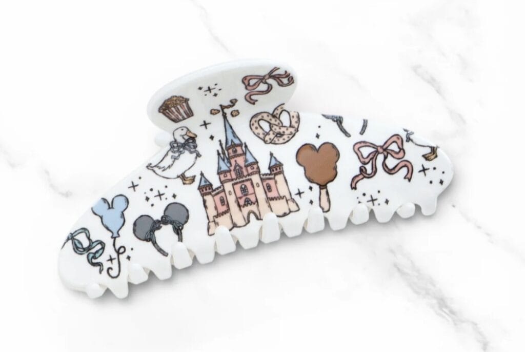 Disney castle hair accessory with whimsical designs.