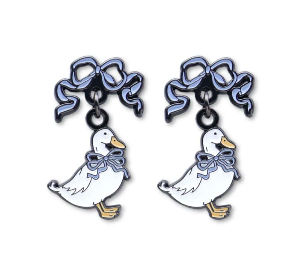 Cute duck-shaped earrings with blue bows and ribbons.