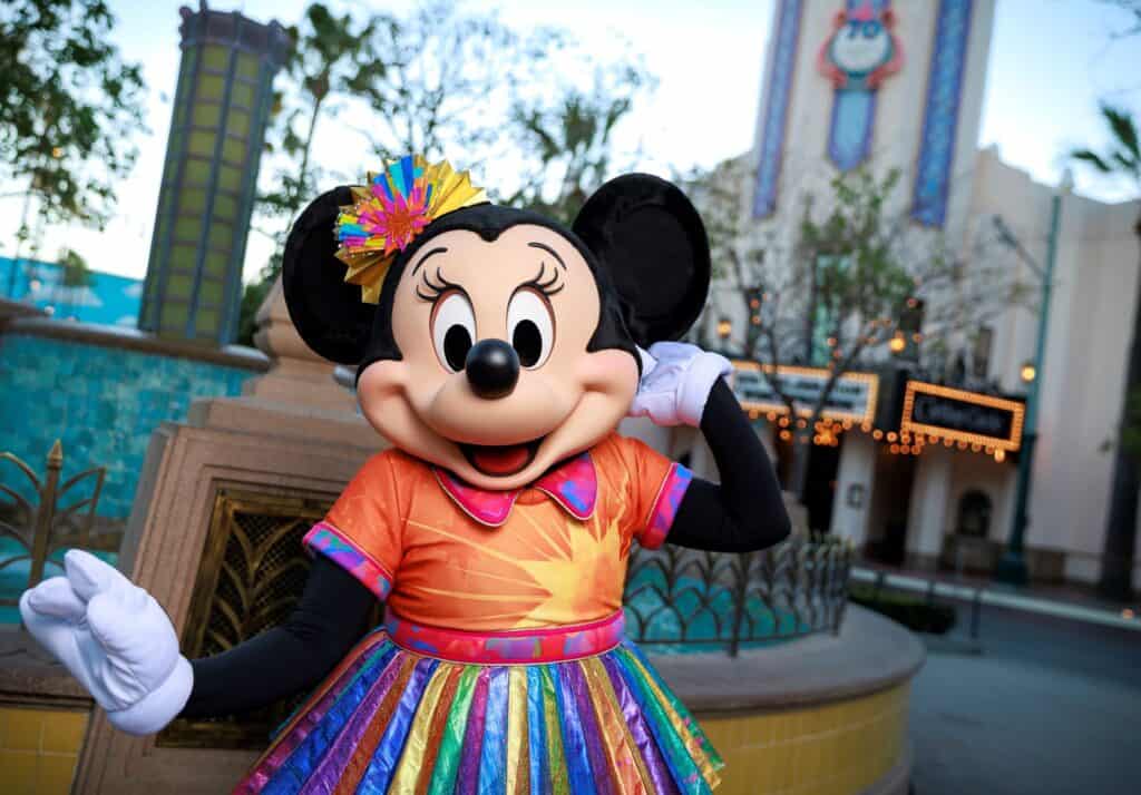 Minnie Mouse in colorful celebration outfit at Disney California Adventure Park.