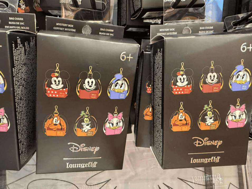 Colorful Loungefly Disney bag charms featuring classic characters like Minnie, Mickey, and more.