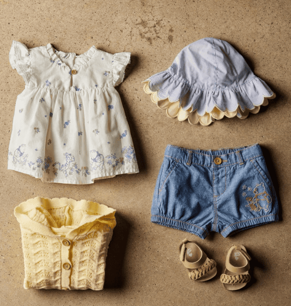 Adorable Winnie the Pooh baby clothes and accessories for celebrating 100 years of Winnie the Pooh.
