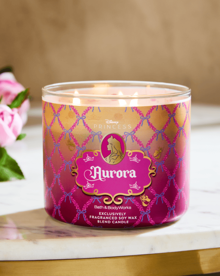 Aurora Disney princess candle with pink and gold design, featuring a fragrance blend and soy wax.