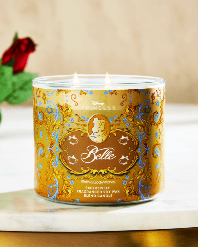Disney Princess Belle scented candle with elegant gold and blue design.