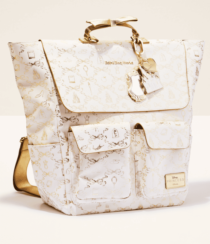 Elegant Disney Princess-inspired fashion bag with gold accents and keychain detail.