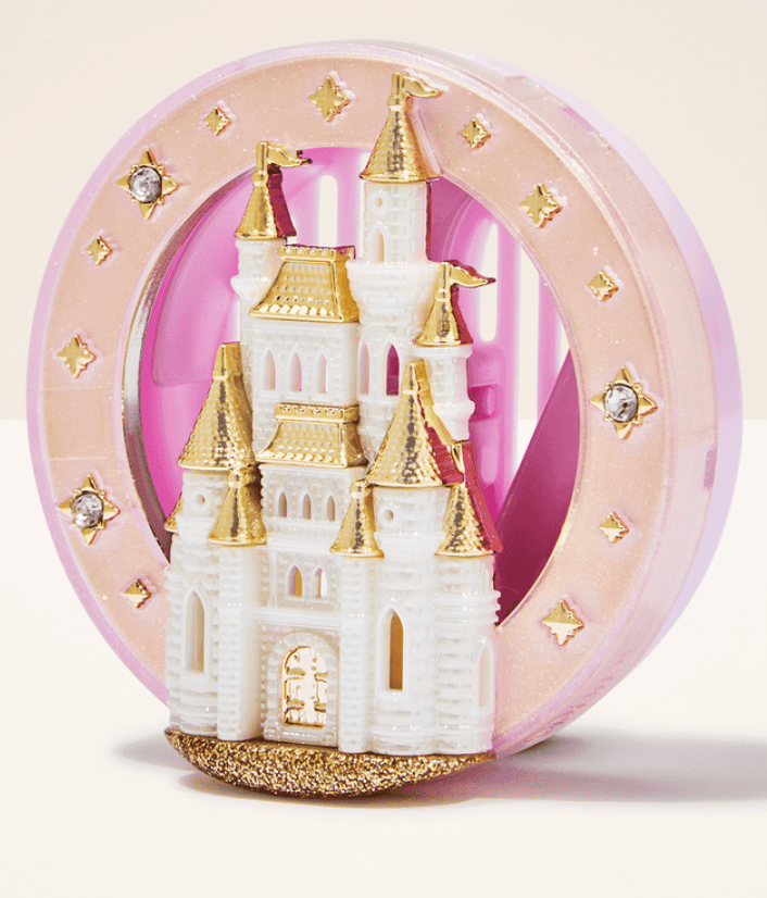 Disney castle snow globe with pink and gold accents, perfect for Disney fans.