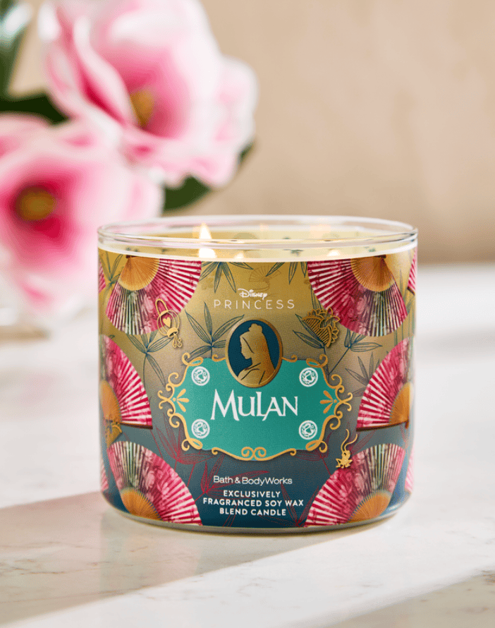Themed Disney Princess scented candle with floral and fan design.