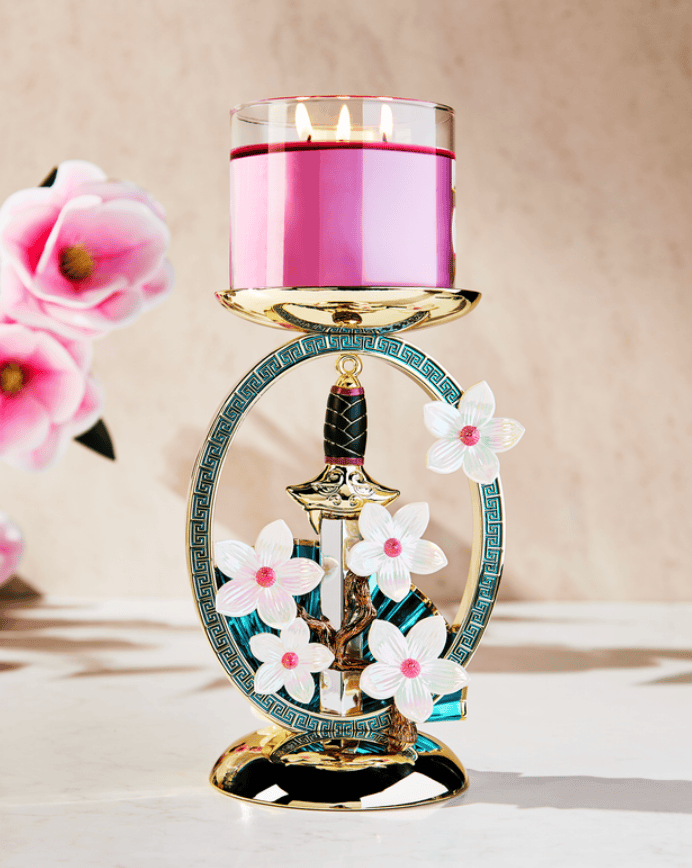 Inspired candle holder with flowers and a sword design.