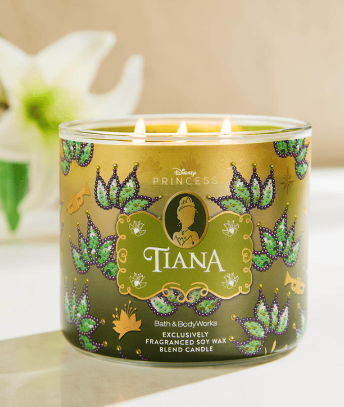 Tiana-themed scented candle with Disney Princess branding and decorative design.