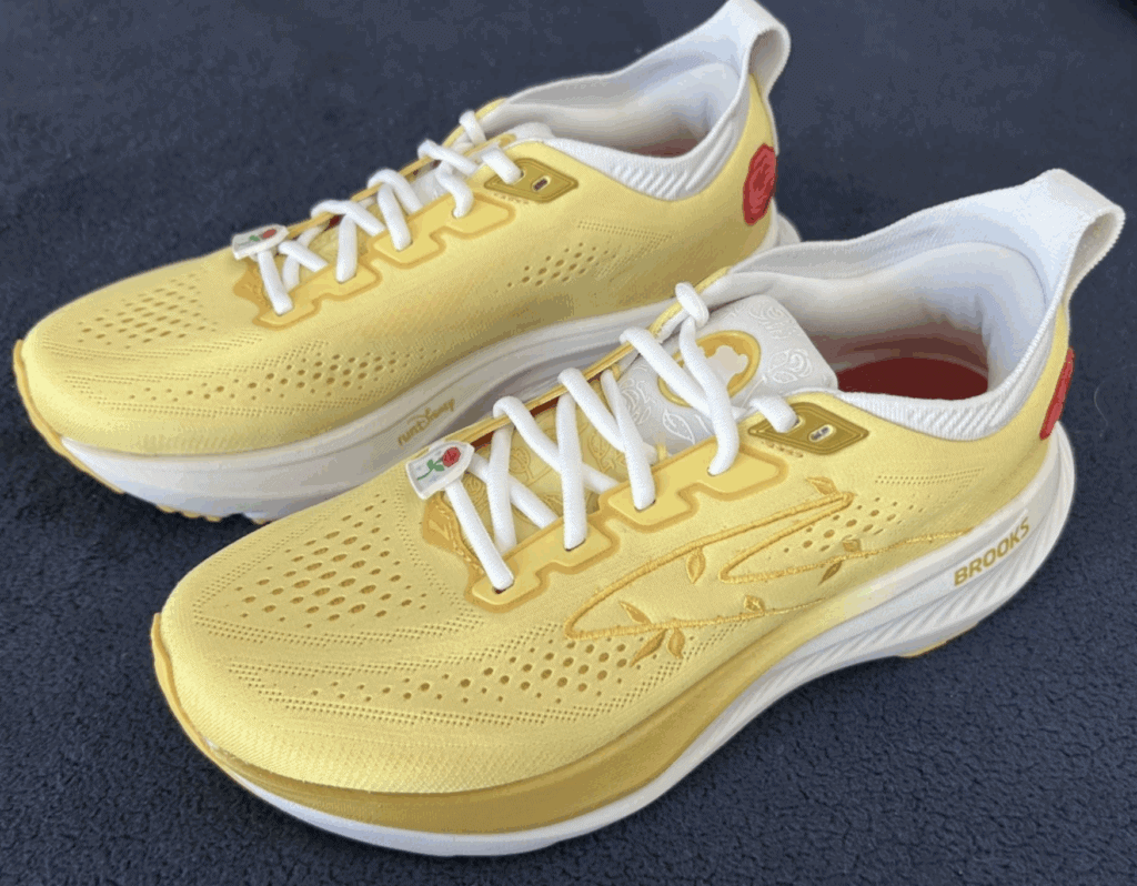 Bright yellow Disney sneakers with red details, perfect for fans and casual wear.