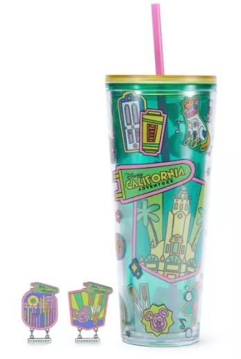 Disney California Adventure themed tumbler with straw and collectible accessories.