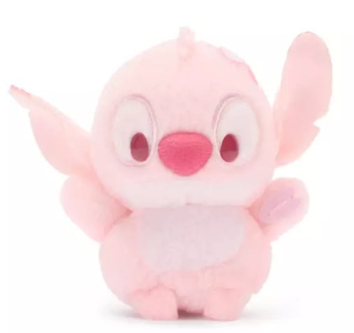 Adorable pink plush toy featuring a Disney character with big eyes and a cheerful expression. Perfec.