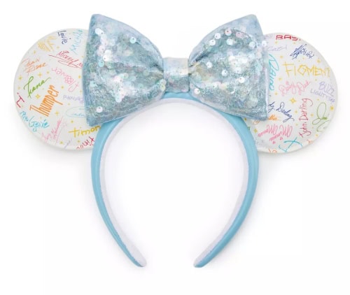 Disney Minnie Mouse headband featuring glitter bow and signature-filled ears for fans and collectors.