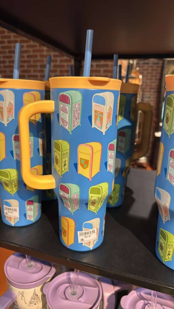 Colorful mug featuring retro vending machine pattern, perfect for Disney fans.