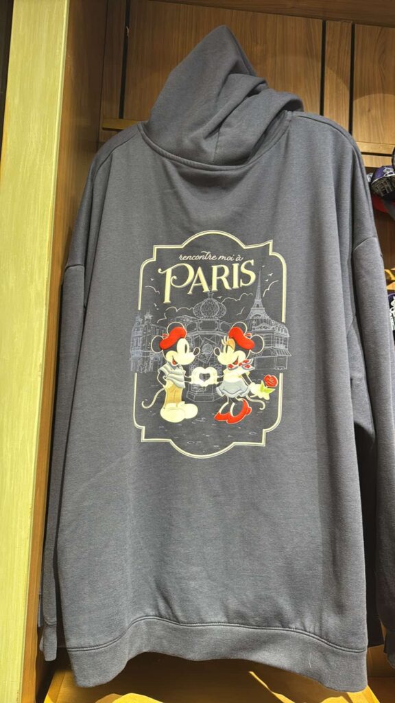 Comfortable gray hoodie featuring Mickey and Minnie Mouse with Paris-themed design.