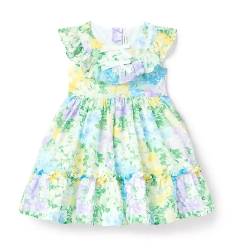 Baby girl floral dress with ruffled sleeves and pastel watercolor print.