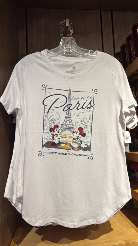 White Disney Paris T-shirt featuring Mickey and Minnie with Eiffel Tower design.