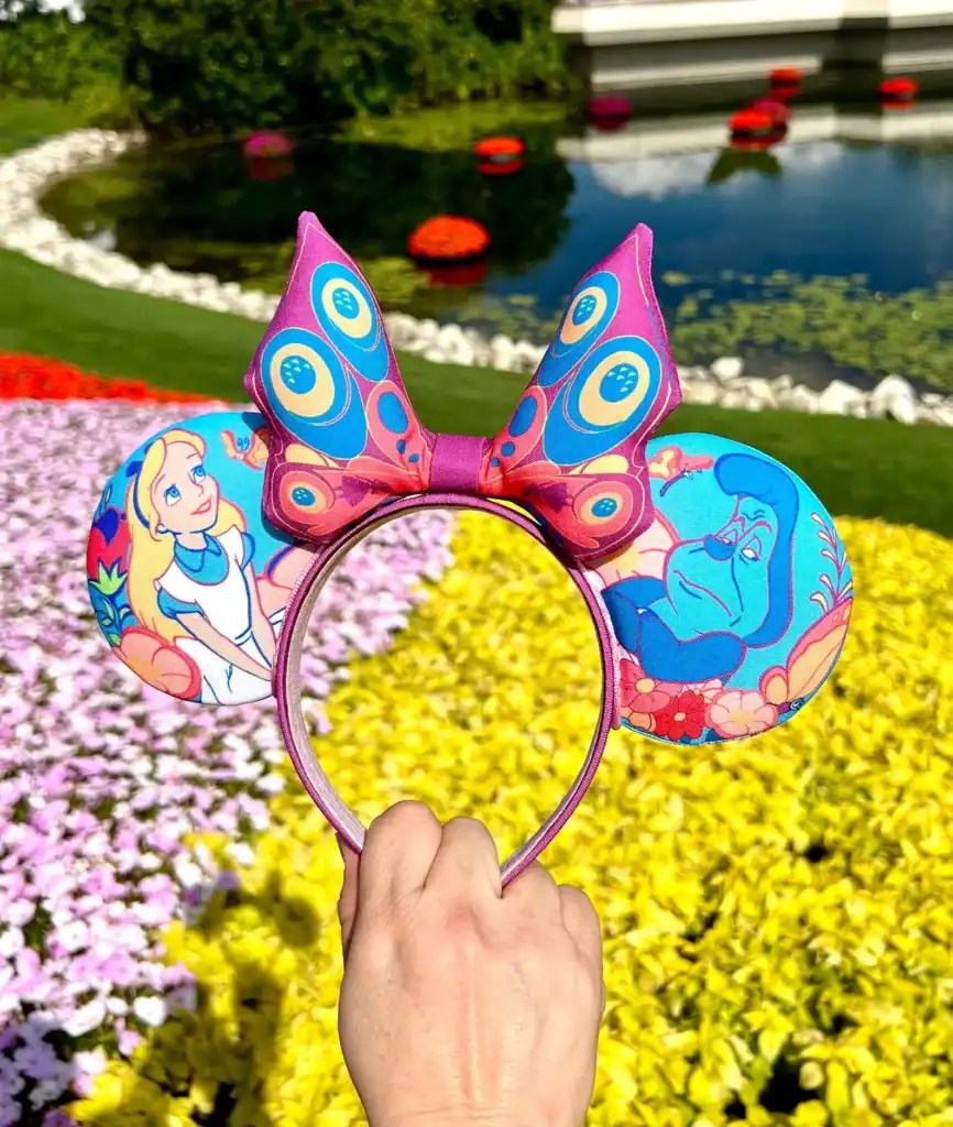 Colorful Disney princess butterfly headband with Ariel and Genie design.