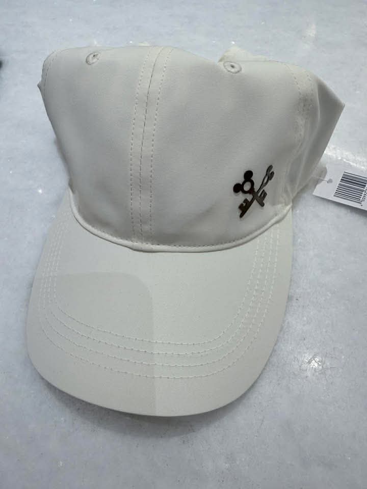 White Disney-themed baseball cap with skull and crossbones logo.