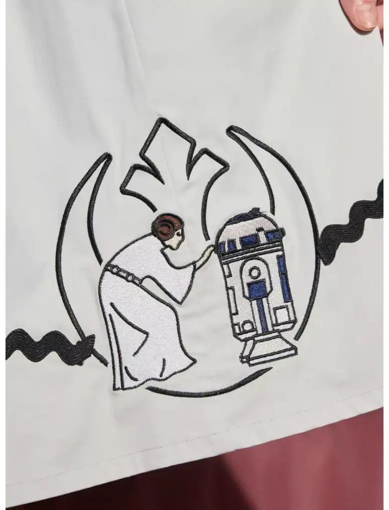 Disney Star Wars fashion design featuring a character with headphones and R2-D2.