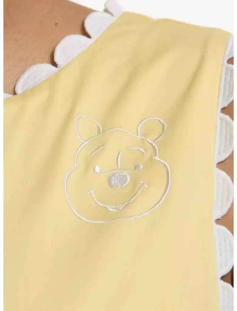 Winnie the Pooh embroidered baby bib with scalloped edges, perfect for Disney-themed baby accessorie.