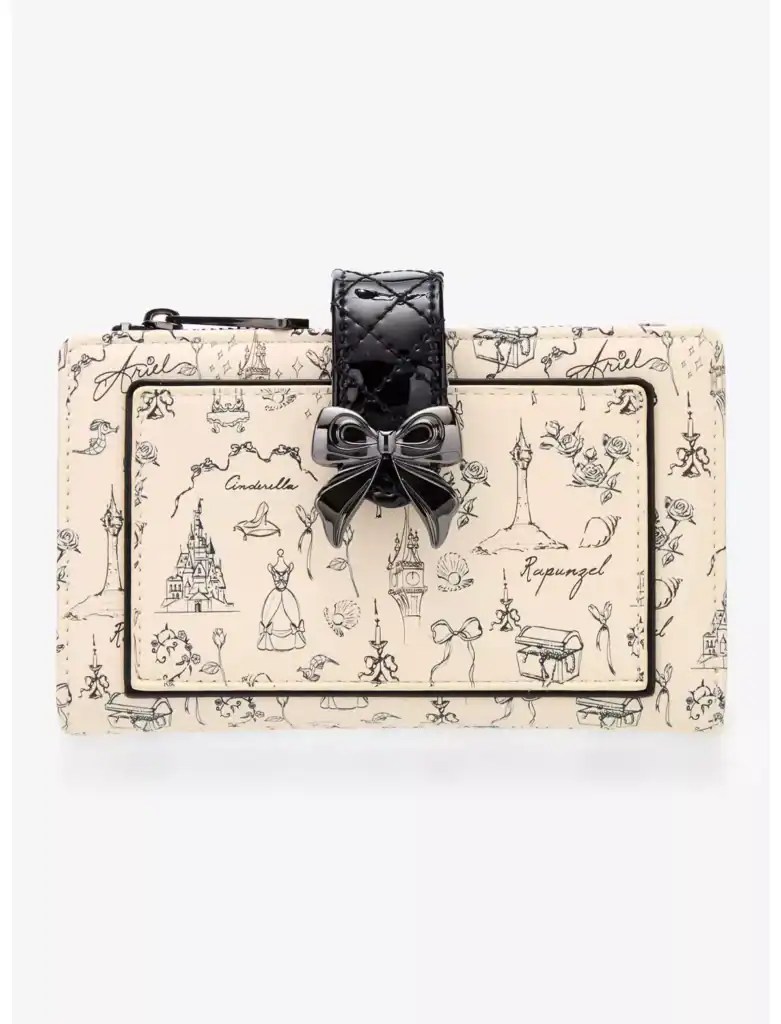 Elegant bow detail on stylish Disney-themed clutch purse. Perfect accessory for a magical day out.