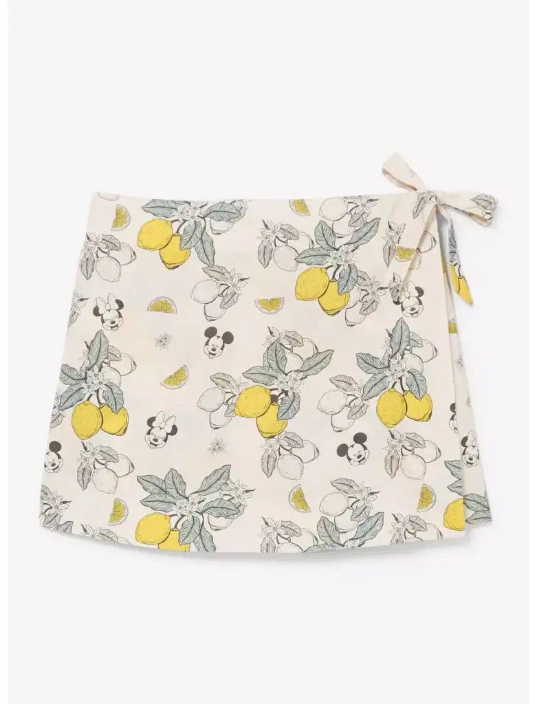 Bright lemon and Mickey Mouse pattern on a stylish white skirt. Perfect Disney fashion for a fresh,.