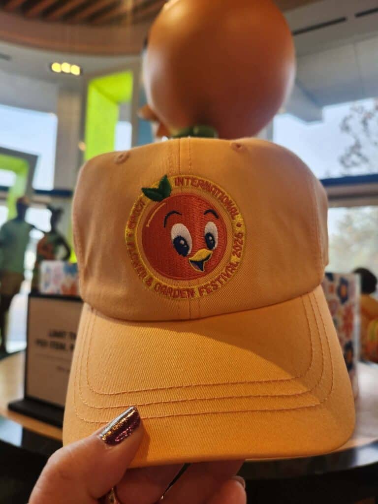 Yellow cap featuring a Disney character and fruit embroidery, perfect for Disney fans.