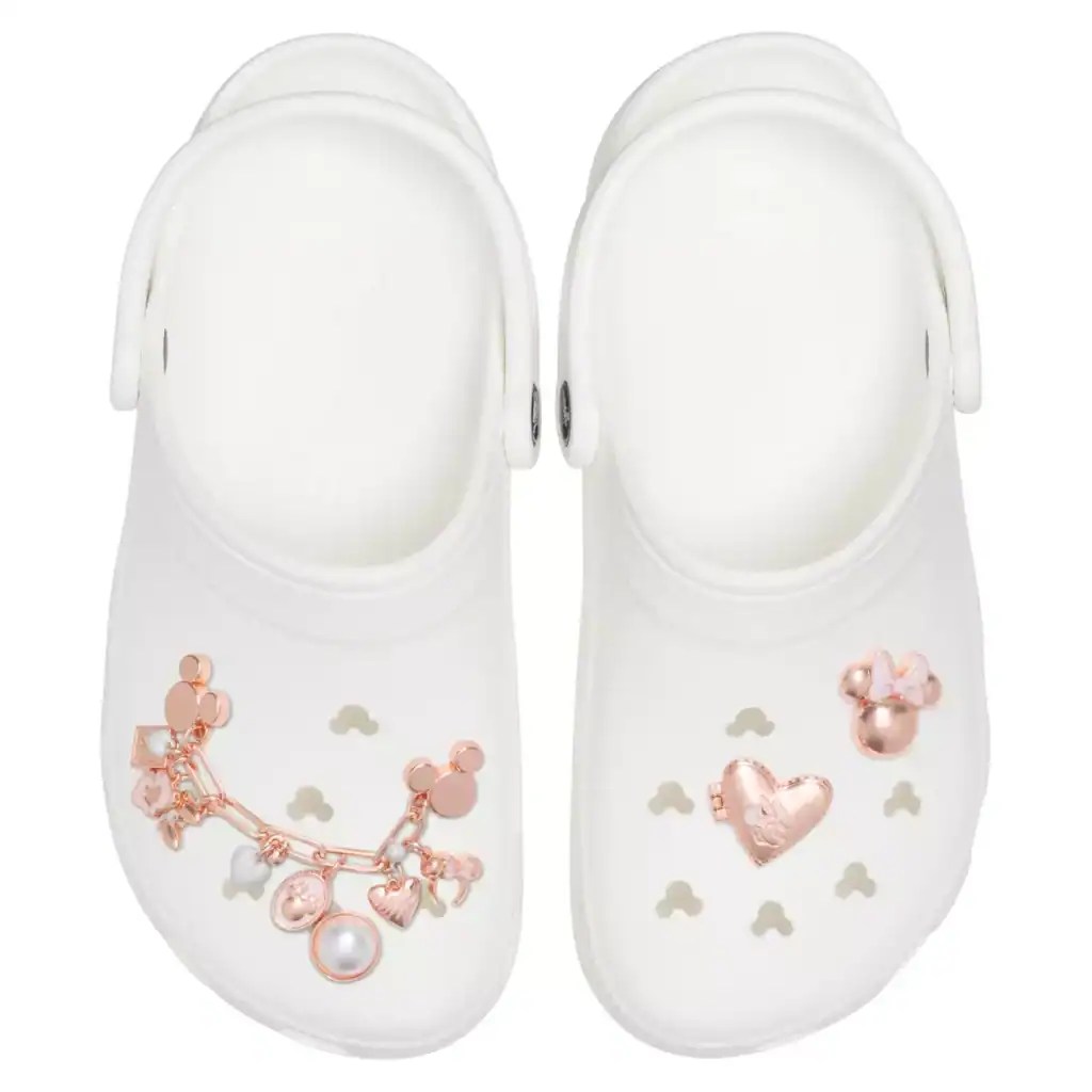 Baby girl Disney shoes with pink heart and charm embellishments, perfect for Disney-themed outfits.