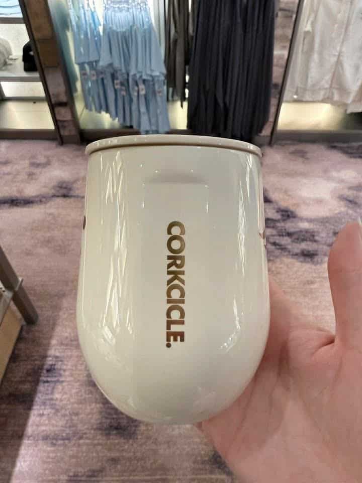 Corkcicle insulated tumbler in white with gold logo.