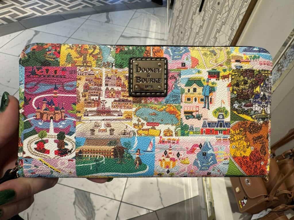 Colorful Disney-themed tapestry wallet with detailed character scenes.