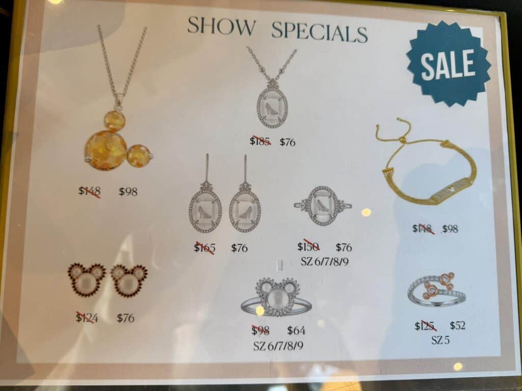 Disney jewelry sale featuring necklaces, earrings, and bracelets.